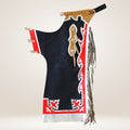 Traditional Native American dance regalia with black, red, and white patterns on a beige background