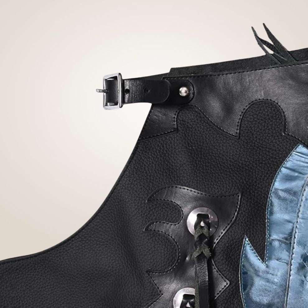 Black leather dress with blue denim fringes on a beige background