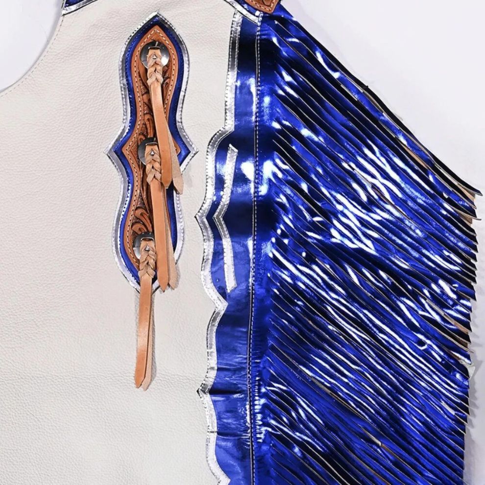 Blue leather vest with decorative patterns and fringe on a white background