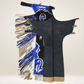 Black dance costume with blue and gold fringes on a beige background