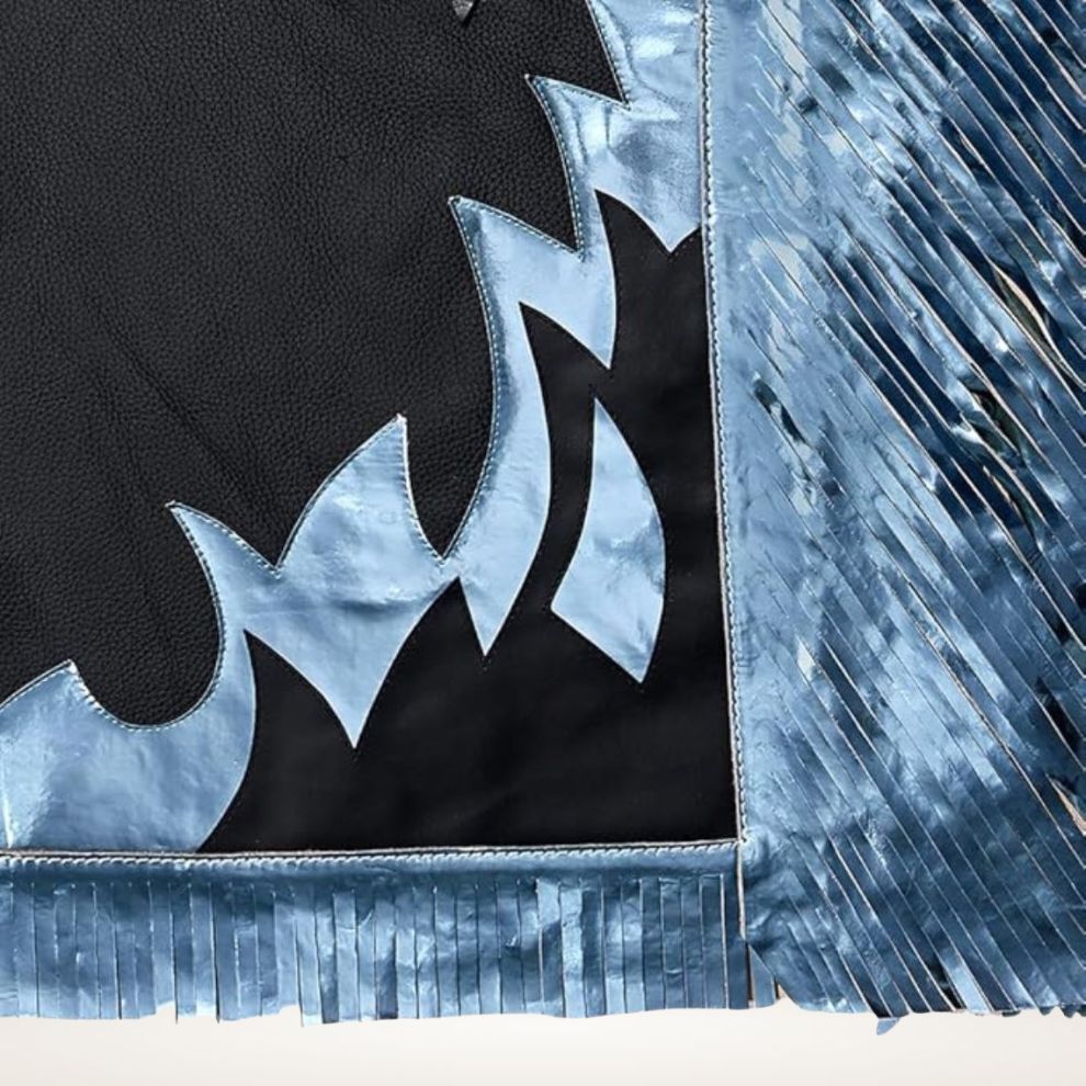 Close-up of a black and blue patterned fabric with fringes.