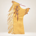 Yellow leather chaps with fringe and decorative elements on a light beige background