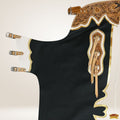 Black fabric with gold embroidery on a white background