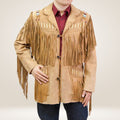 Person wearing a tan fringed jacket with decorative elements on a plain background