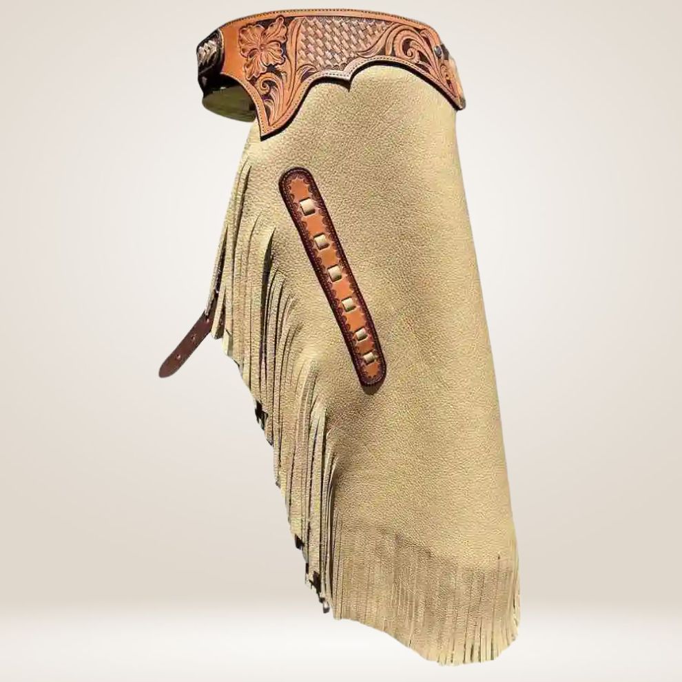 Beige leather chaps with brown leather accents and fringes on a light beige background