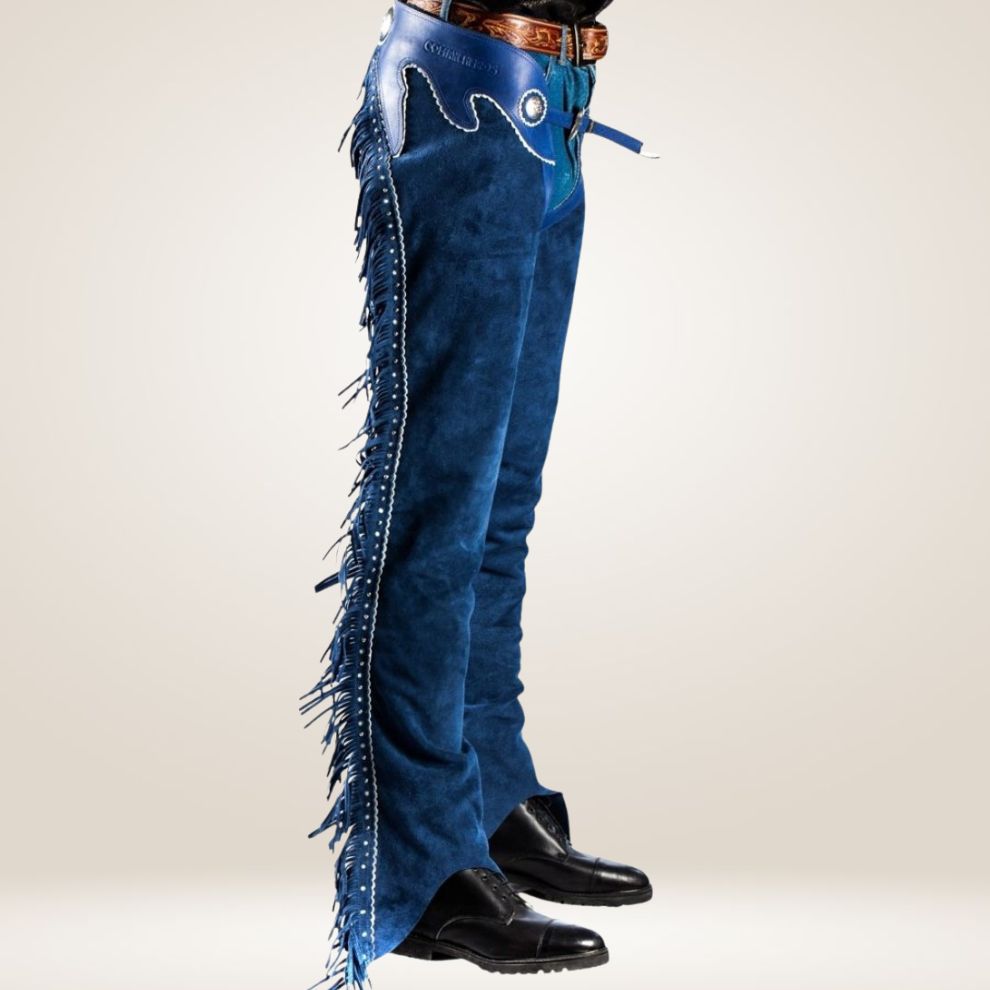 Blue jeans with fringe details on a plain background