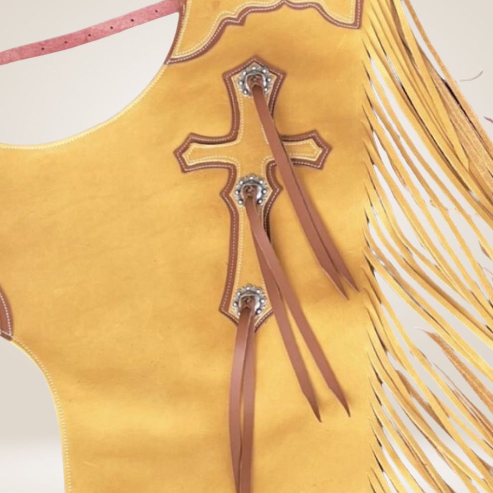 Yellow fringed leather dress with decorative elements on a light beige background