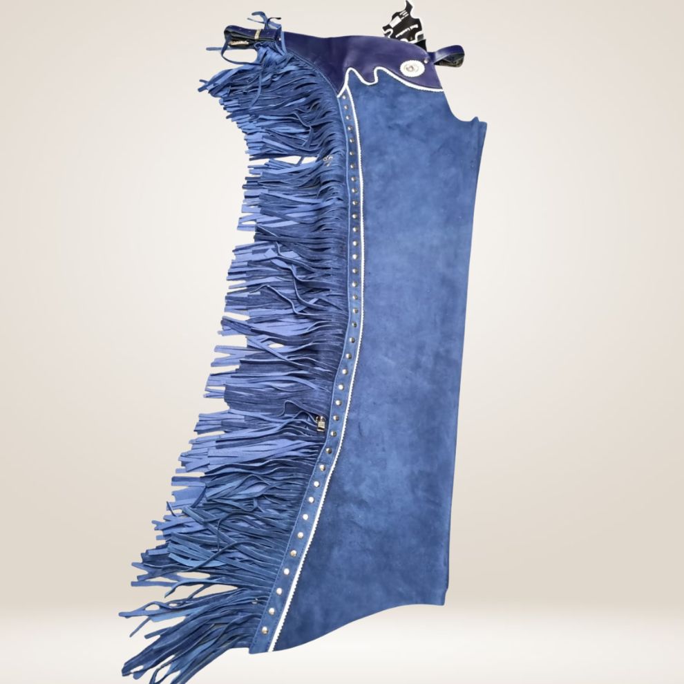 Blue jeans with fringe details on a plain background