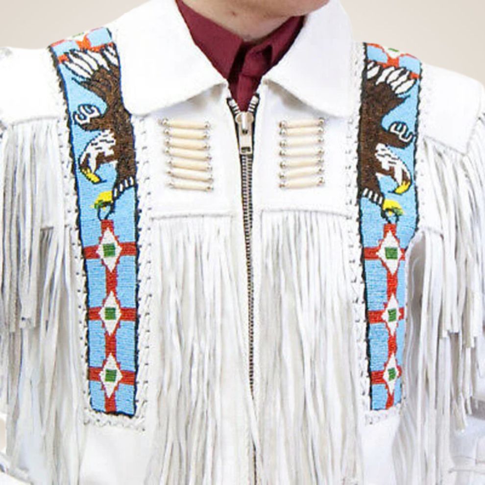White fringed jacket with colorful beaded eagle designs on a plain background
