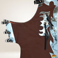 Brown leather apron with metal accents on a beige background