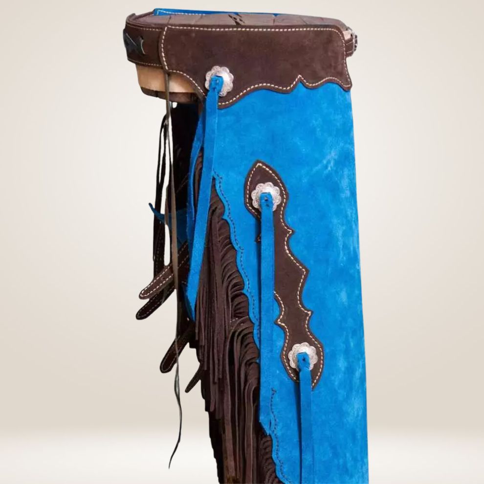 Blue leather bag with brown fringe and decorative stitching on a beige background