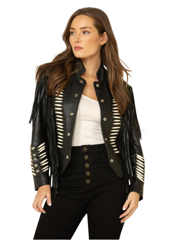 Woman wearing a black leather jacket with white embellishments on a white background