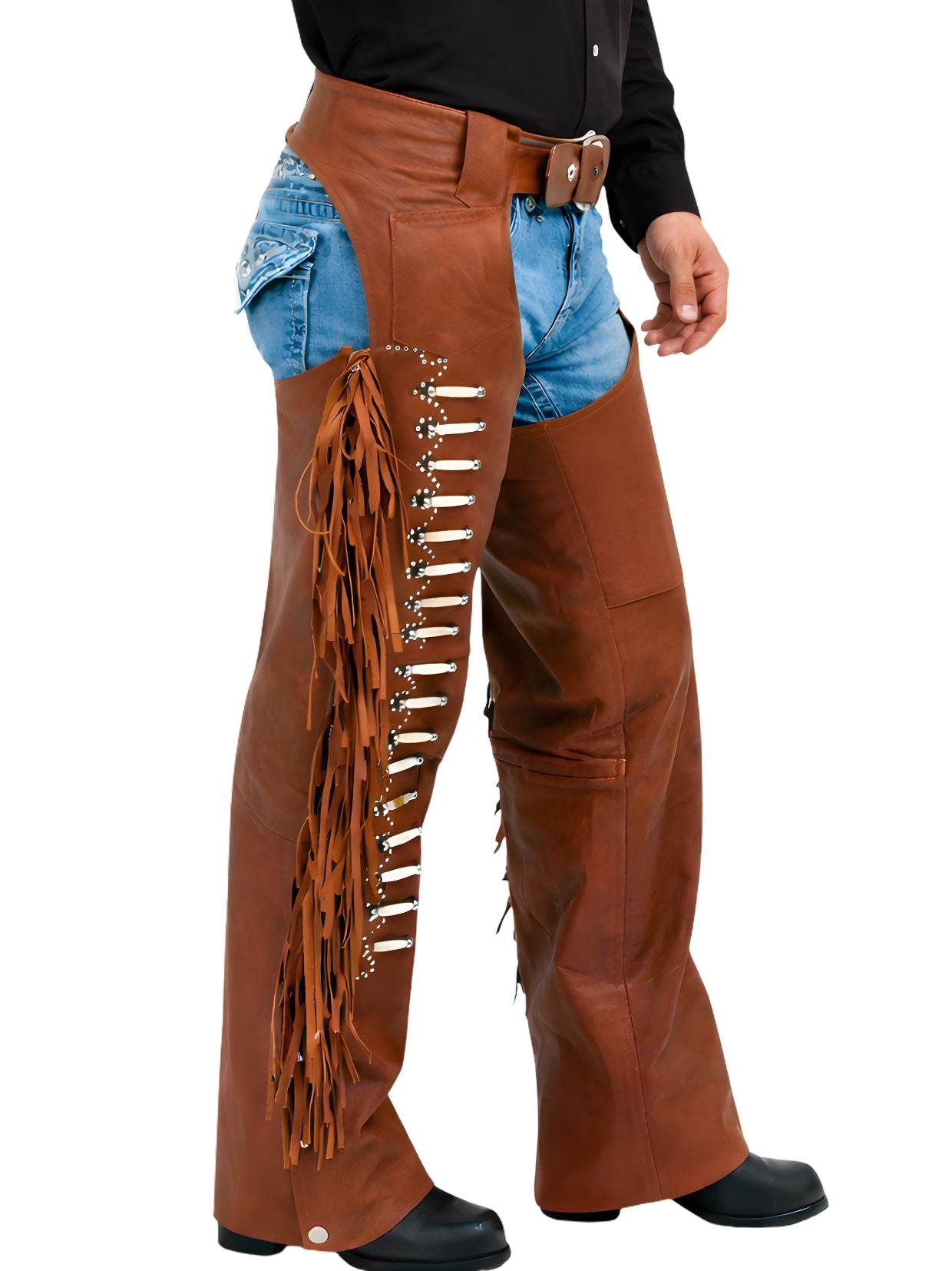 Brown leather chaps with fringe and studs worn over denim shorts on a white background