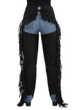 Black fringed pants over denim shorts on a white background