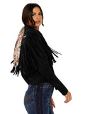 Woman wearing a black fringe jacket with a white background