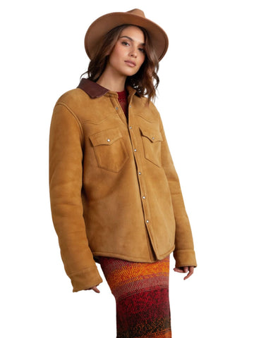 Woman wearing a brown jacket and hat on a white background