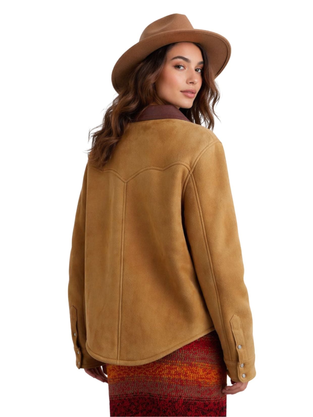 Woman wearing a brown suede jacket and hat on a white background