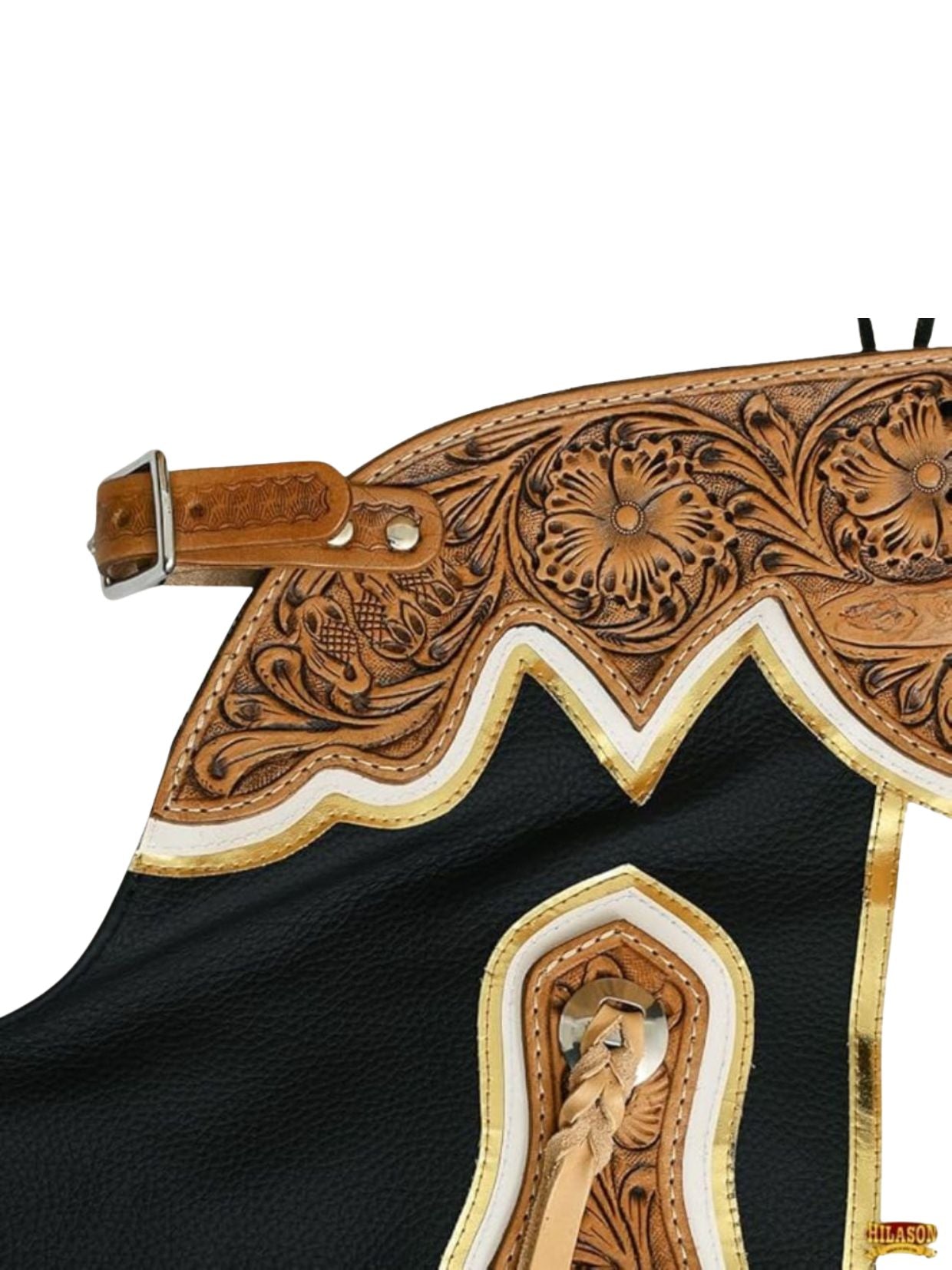 Close-up of a intricately designed leather saddle with floral patterns on a white background