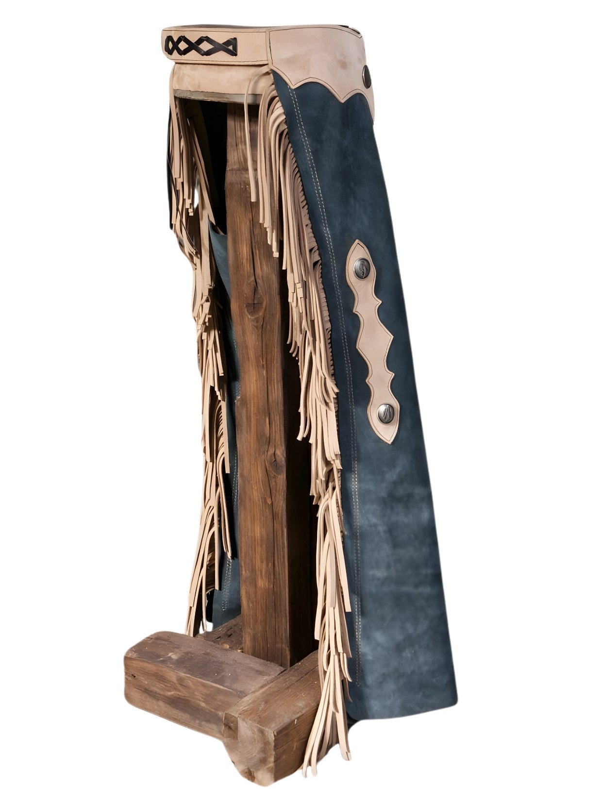 Traditional leather chaps with fringes on a wooden stand against a white background