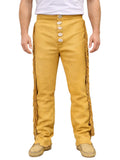 Mustard yellow pants with button details and fringes on a white background