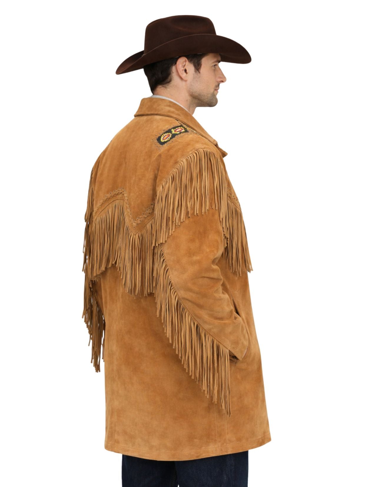 Man wearing a tan suede leather jacket with fringes and a brown cowboy hat on a white background