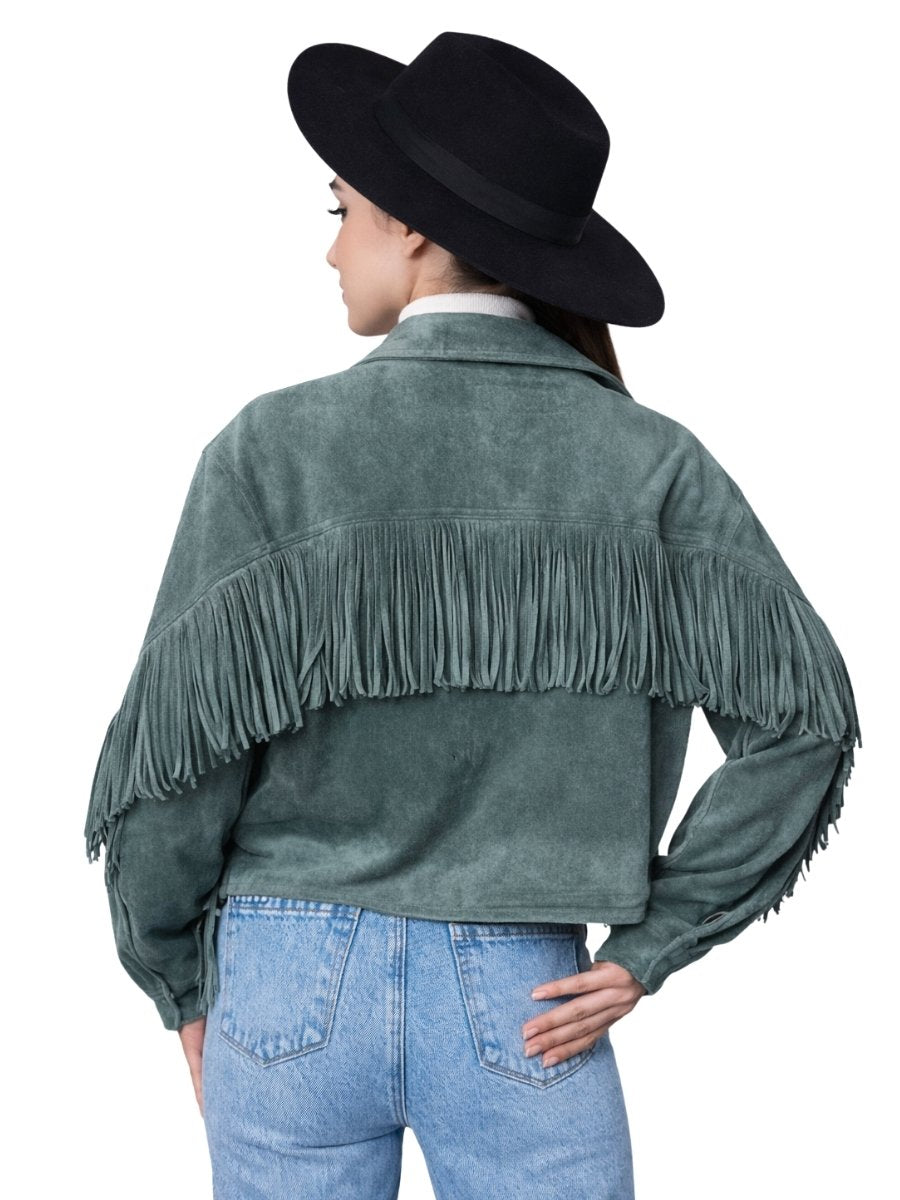 Person wearing a green fringed jacket and black hat on a white background